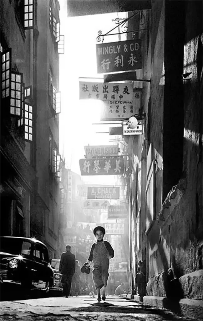 A lonely child in a busy street